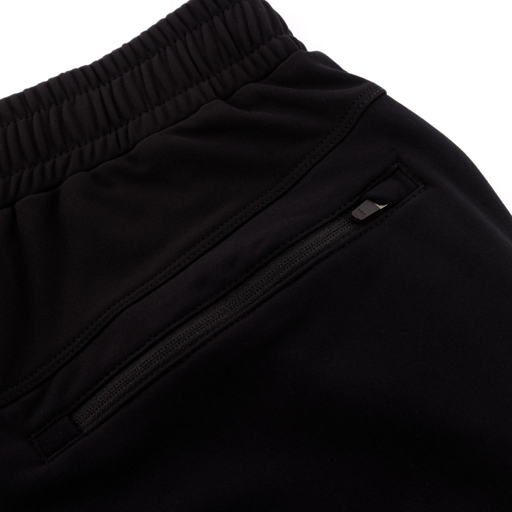 Close up of the elasticated waistband and zip pockets on the Belu Life black mens joggers