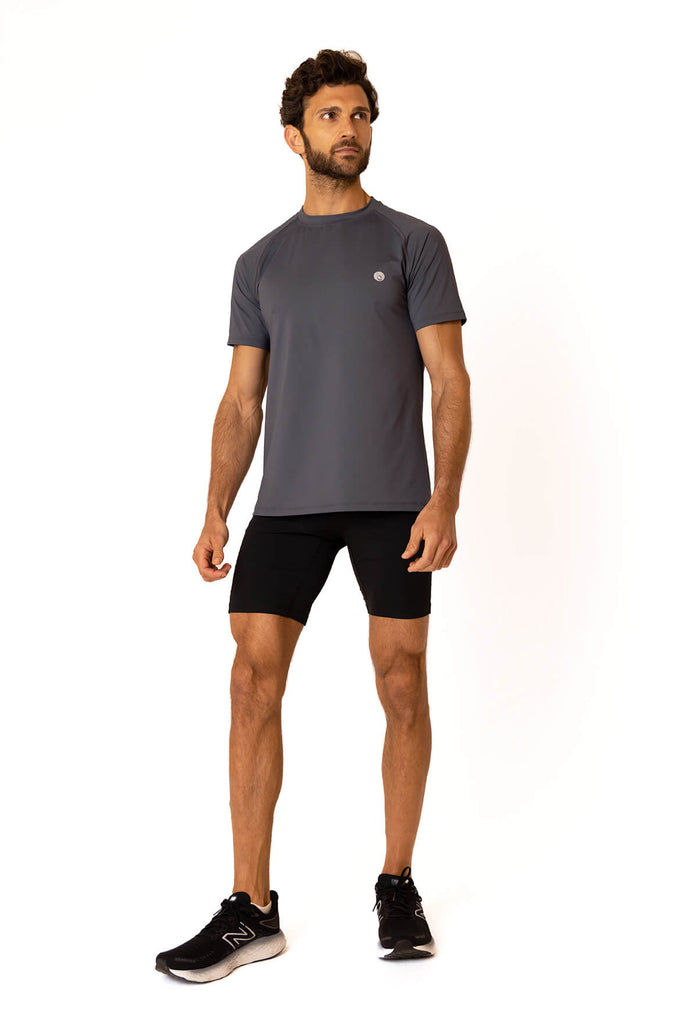 Image of man standing ready for exercise in his black atlantic workout t shirt from Belu Life 