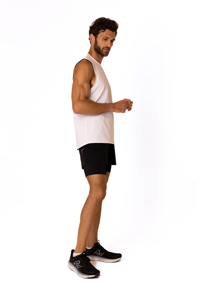 side profile of the white Sahara Vest from Belu Life. A mens gym vest which is lightweight and loose fitting designed for all types of exercise