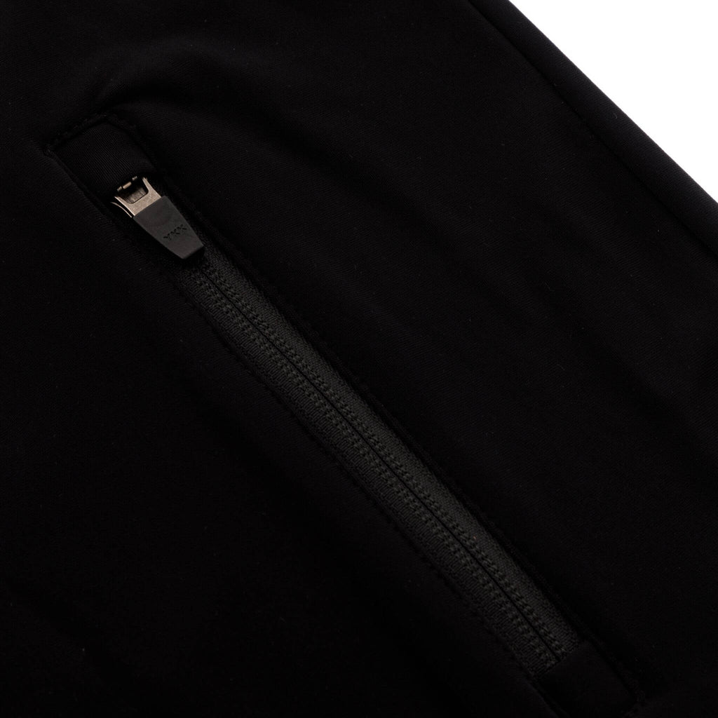 Detailed image showing the zipper on the pocket of our women's half zip fleece in black 